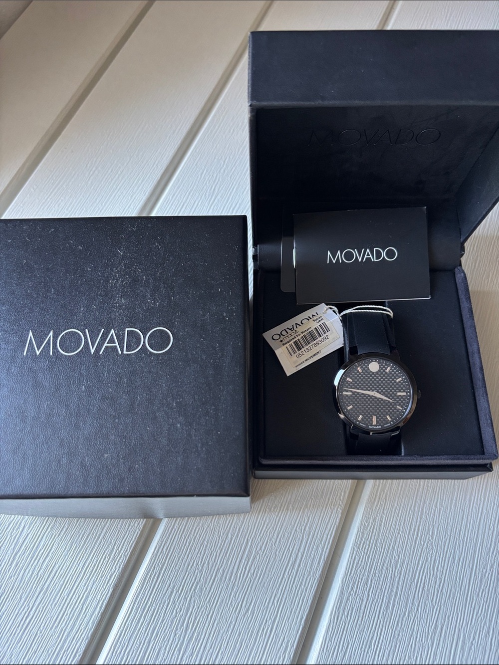 Movado Men's Black Textured Dial Watch with Black Leather Strap needs battery